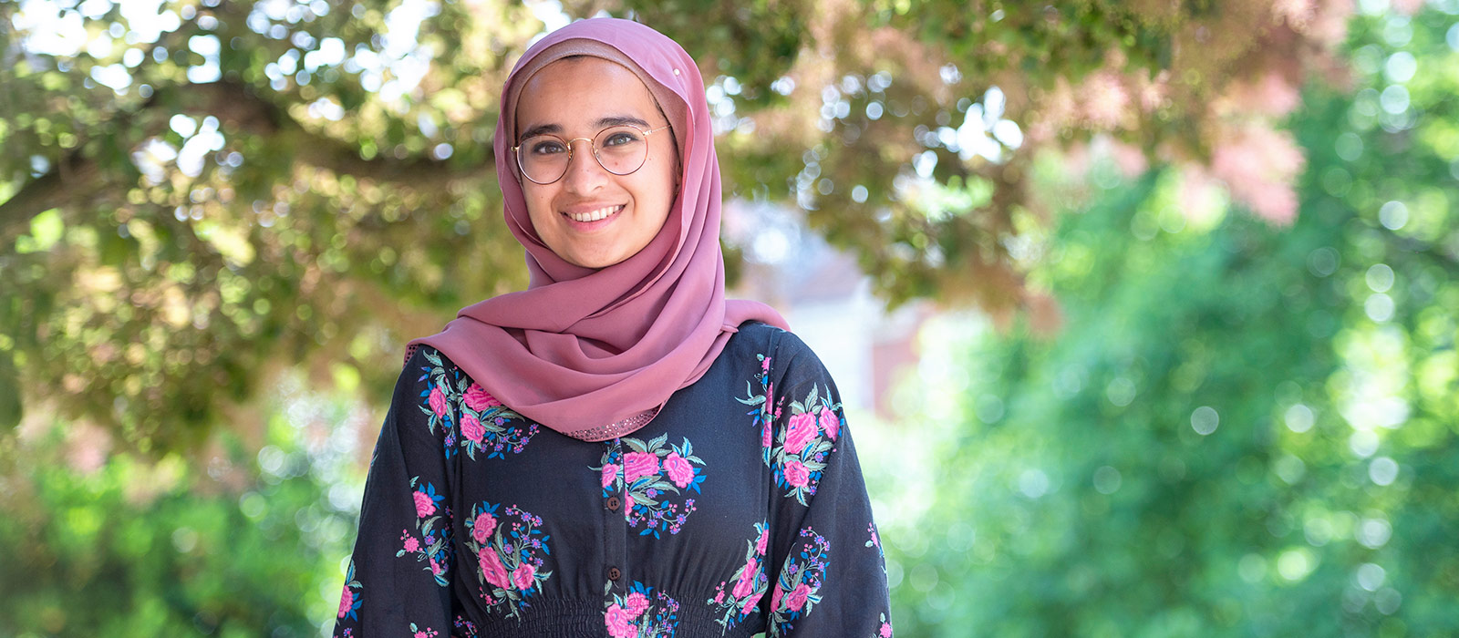 OPP Scholar Minha Khan in the grounds of Lady Margaret Hall